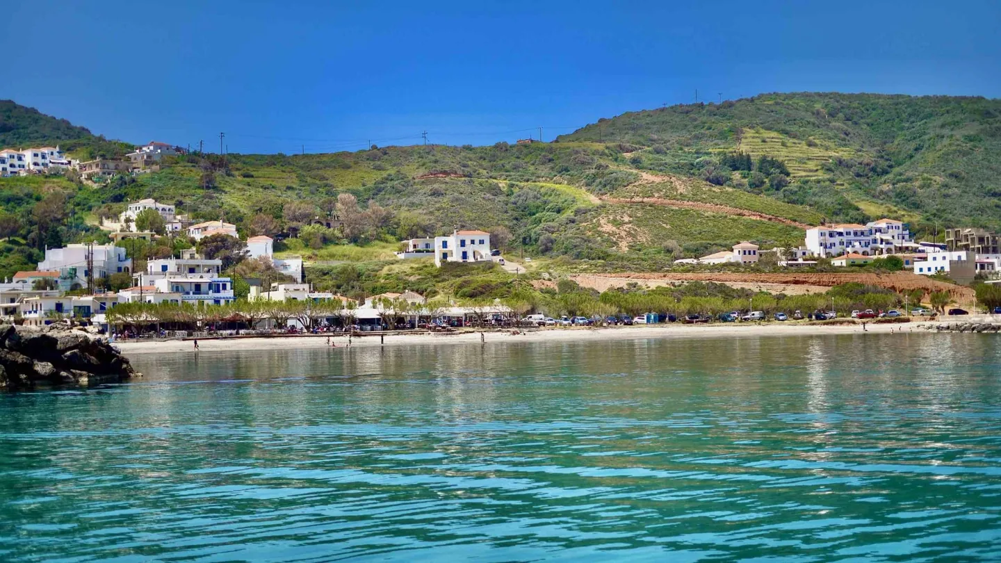 Agia Pelagia bay on Kythira with a sandy beach, tavernas and green hills